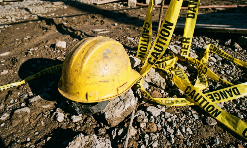 Dramatic low-angle view of unstable construction scaffolding against a clear McAllen Texas sk