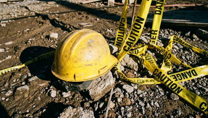 Dramatic low-angle view of unstable construction scaffolding against a clear McAllen Texas sk